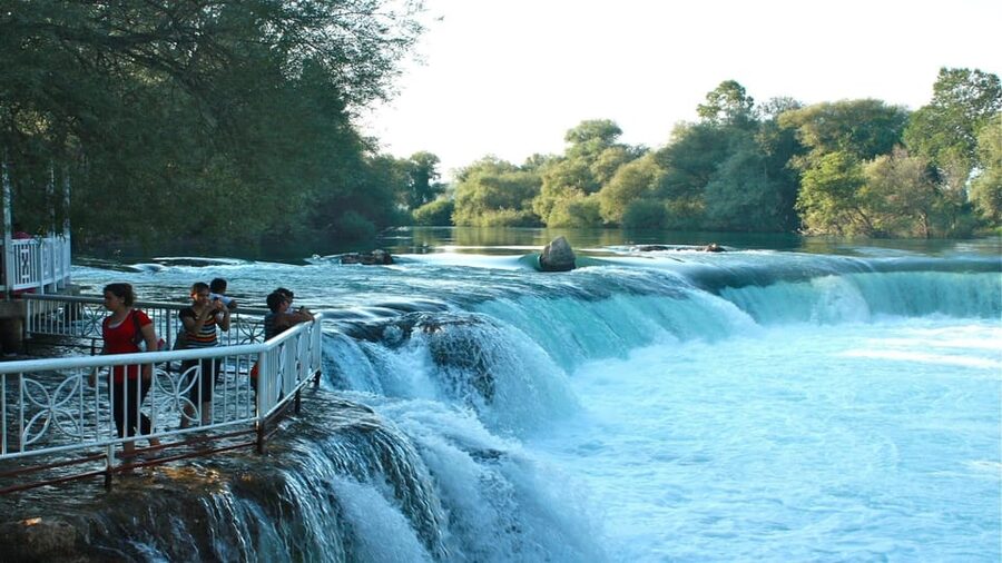 Alanya/Side: Manavgat River & Waterfall, Boat Tour, & Bazaar - Hotel Pickup and Transfers: Side Convenience vs. Open-Sided Bus Reality
