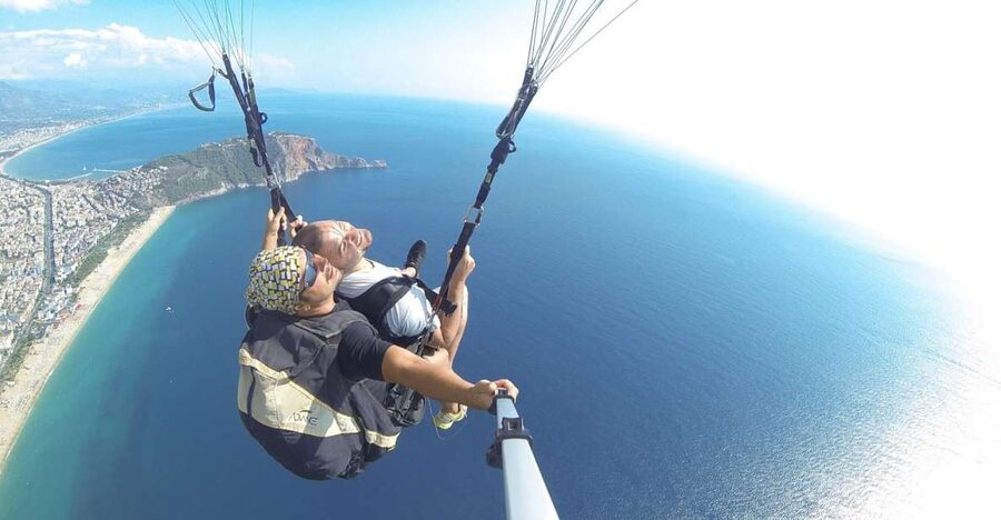 Alanya: Tandem Paragliding Experience Over Cleopatra Beach - Meeting the day: Tourmania sign, Ulusky office, and a quick plan