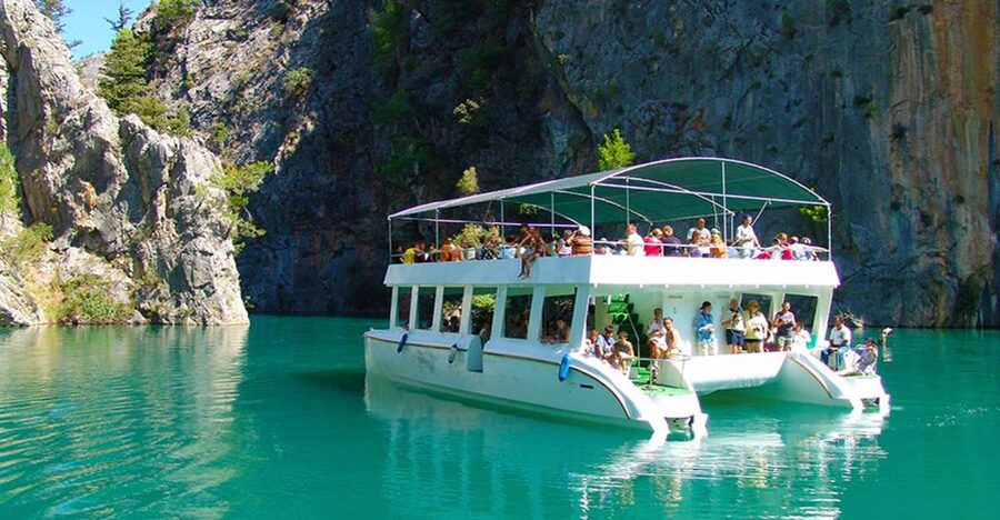 From city of Side : Excursion to Green Canyon - Bus ride details: ticket collection and multi-language guidance